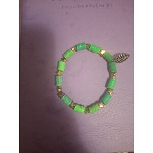 Green Heishi Bead Stretch Bracelet with Gold Star Spacers and Leaf Charm Boho